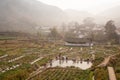 Peaceful village. Scenic ancient village landscape, a group of chinese woman washing at the old pool in potatoÃ¢â¬â¢s field in the